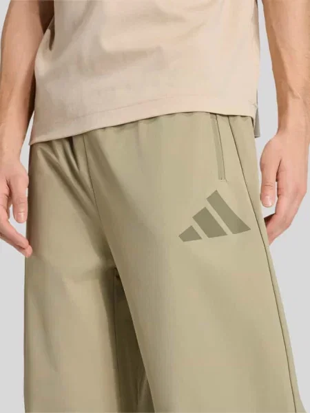Spodnie treningowe o kroju regular fit model Z.N.E. WOVEN' Adidas Sportswear