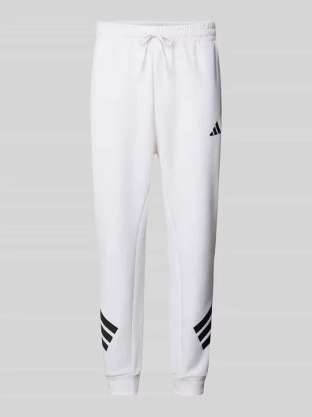 Spodnie dresowe z logo i elastycznym pasem Adidas Sportswear biały