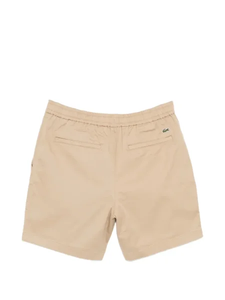 Chino hlače Lacoste pokrpan
