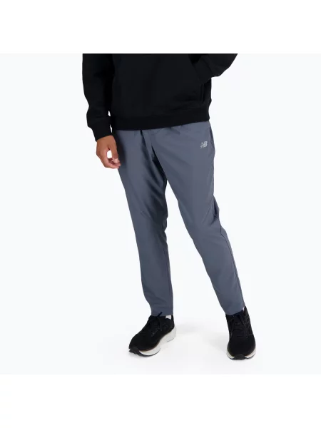Kalhoty New Balance AC Stretch Woven 29 Inch graphite šedé