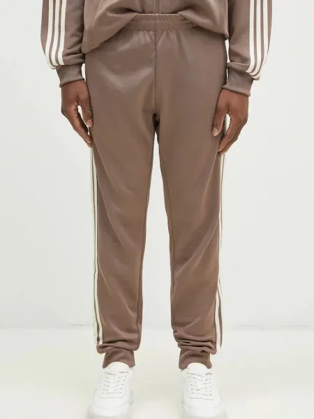 Donji dio trenirke adidas Originals SST TP s aplikacijom bež