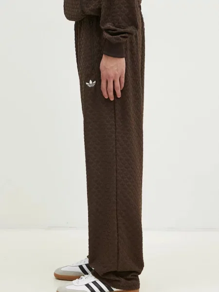 Спортивні штани adidas Originals MONOGRAM TR однотонні коричневий