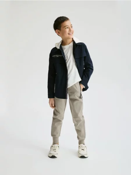 Reserved Спортивні штани jogger бежевий