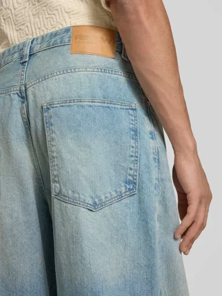 Jeansy o kroju super baggy fit z czystej bawełny z przetarciami Review