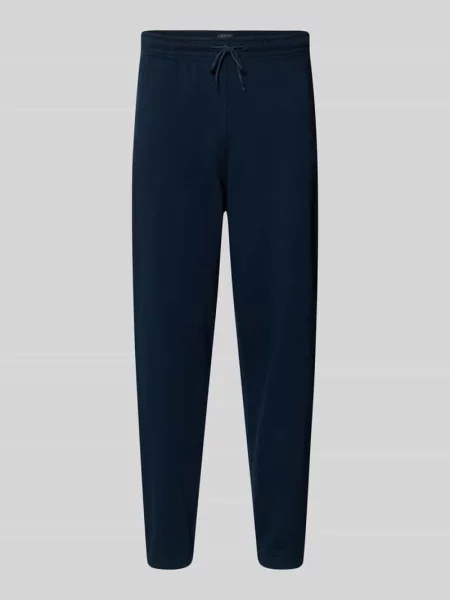Spodnie dresowe o kroju regular fit z mieszanki bawełny Tommy Jeans granatowe