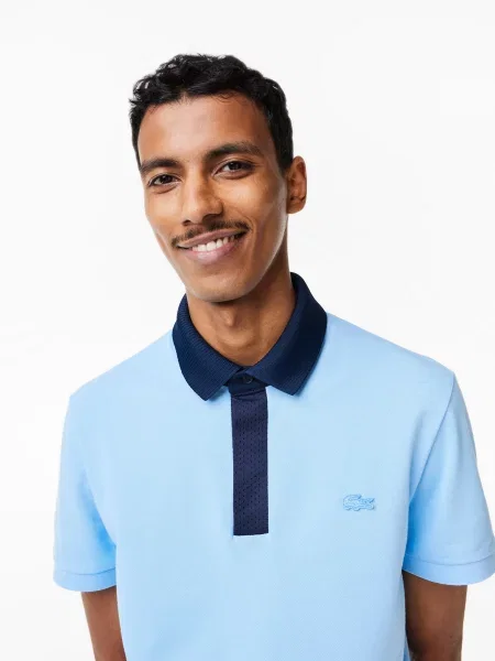 Поло Lacoste голубое