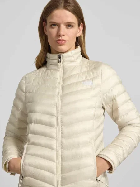 Pikowana kurtka ze stójką i przeszytym logo The North Face beżowa