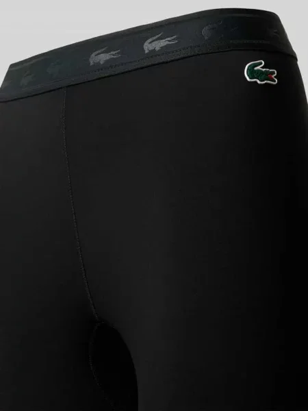 Legginsy sportowe o kroju slim fit z nadrukiem z logo Lacoste Sport czarne