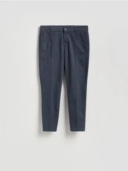 Reserved Spodnie jogger z zakładkami granatowy