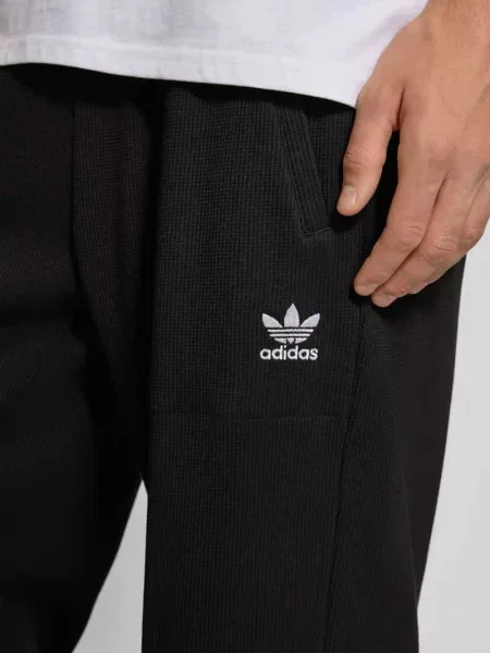 Spodnie dresowe z elastycznym ściągaczem Adidas Originals czarny