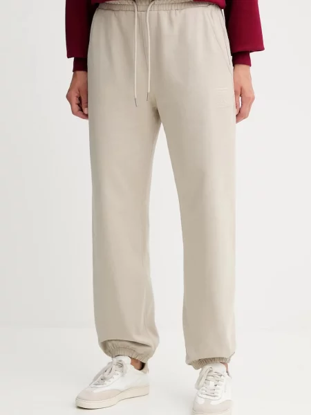 Tepláky Calvin Klein s aplikací béžová