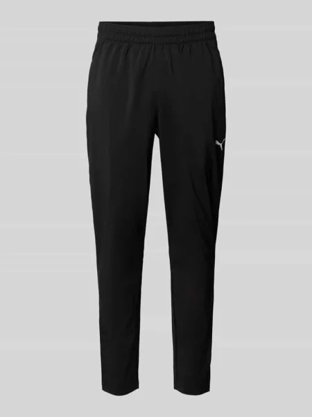 Spodnie dresowe o kroju tapered z elastycznym pasem model TAD ESSENTIALS' Puma Performance czarne