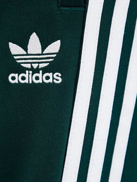 Спортивні штани adidas Originals Sst Tp з аплікацією зелений