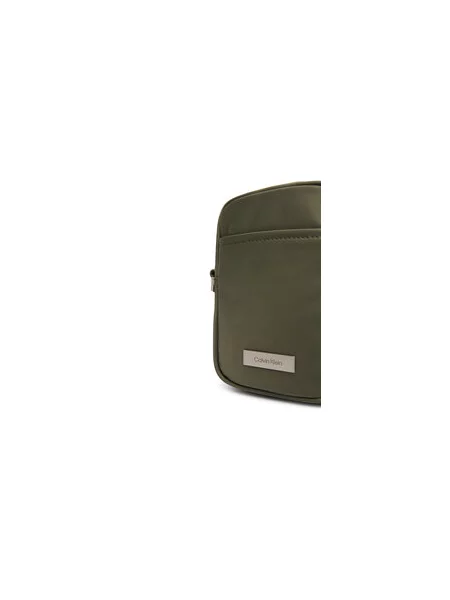 Calvin Klein Torbica za okrog pasu Sleek Slim Reporter zelena