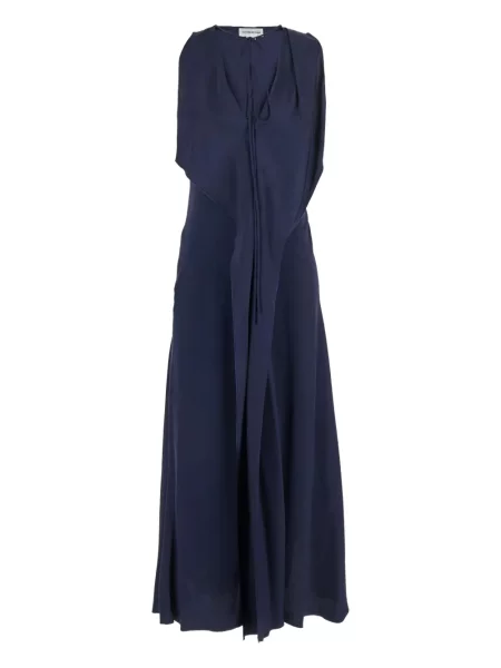 Rochie Victoria Beckham drapată de costum albastru