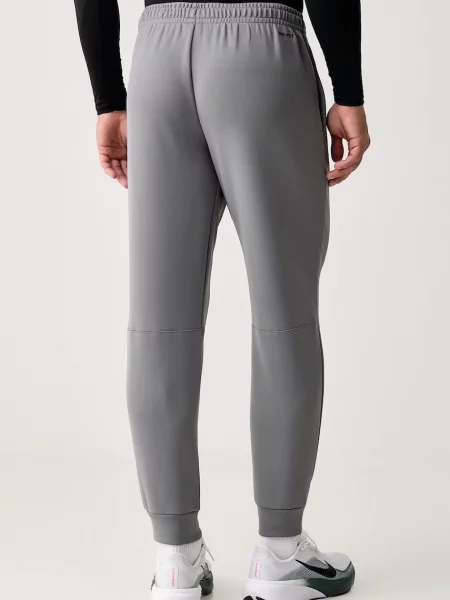 Nike spodnie treningowe Hyverse UV Dri-FIT szare