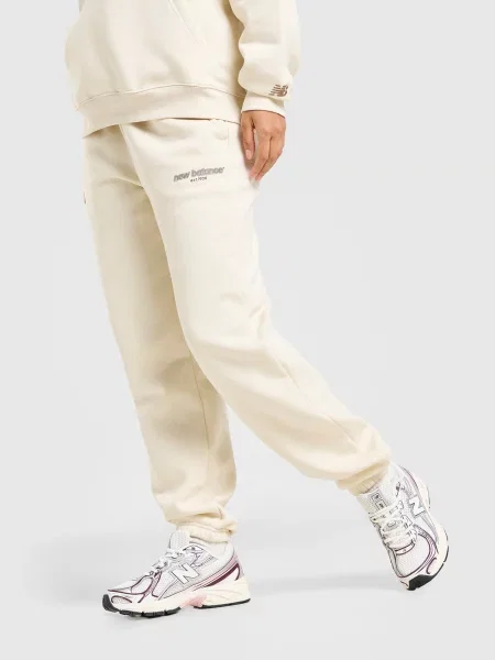 New Balance Spodnie Collegiate Cuff beżowe