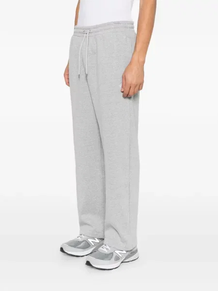 Haftowane spodnie The North Face do biegania szare
