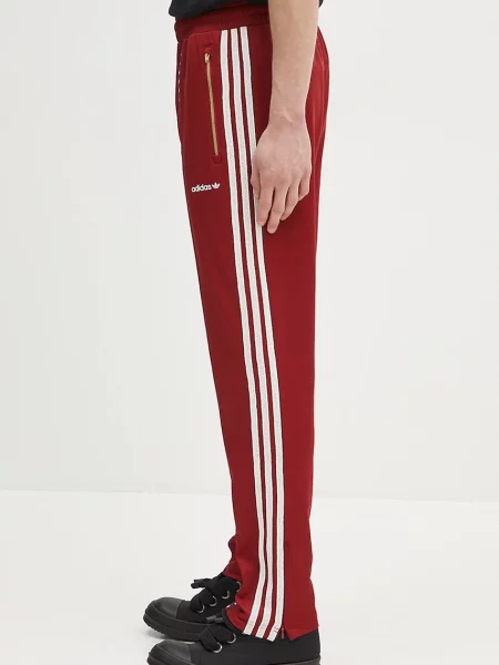 Tepláky adidas Originals s aplikací vínová