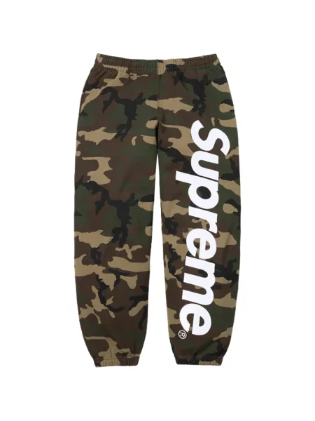 Pantaloni Supreme din satin cu imagine cu model camuflaj verde