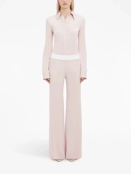 Kelnės Victoria Beckham įsiliepsnojo rožinė